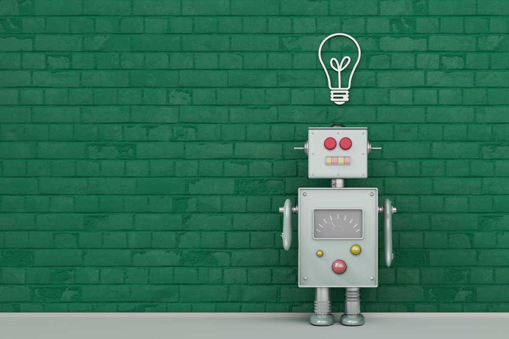 Um robô cinza está sobre um fundo de tijolos verdes. Na parede, sobre a cabeça do robô, há uma lâmpada desenhada